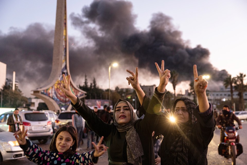 Syrians dance and celebrate in Syria on Sunday after Assad’s downfall