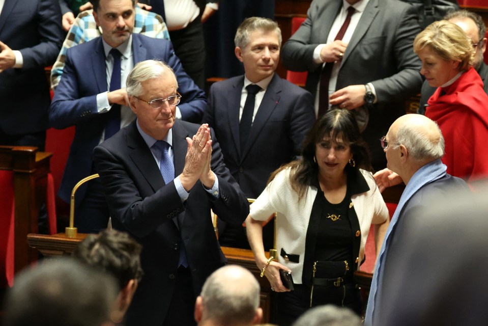 French Prime Minister Michel Barnier gestures after the result of the no-confidence vote on his administration