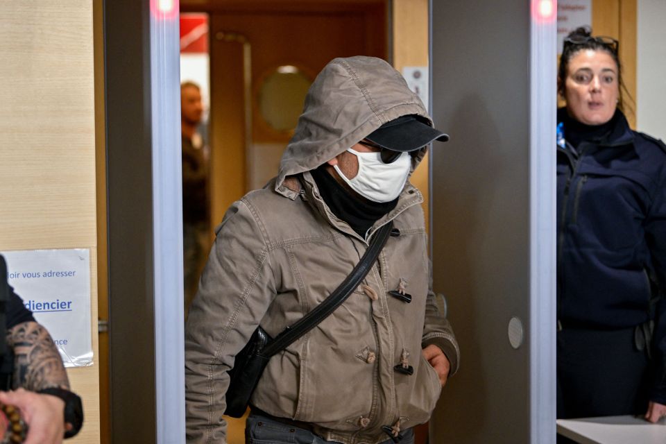 A defendant exits the courthouse during the trial in November