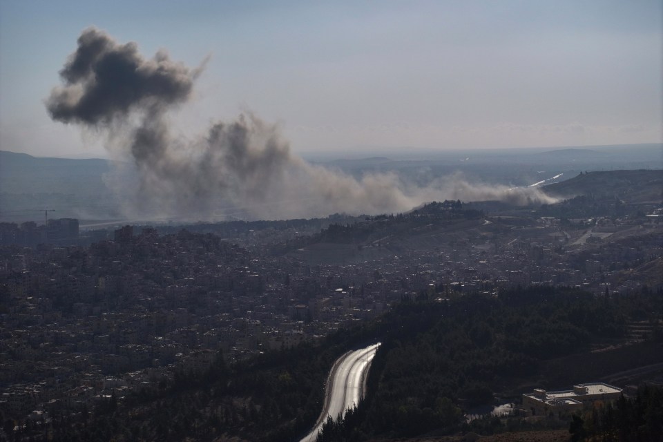 Smoke billows following an Israeli airstrike on the outskirts of Damascus on Sunday