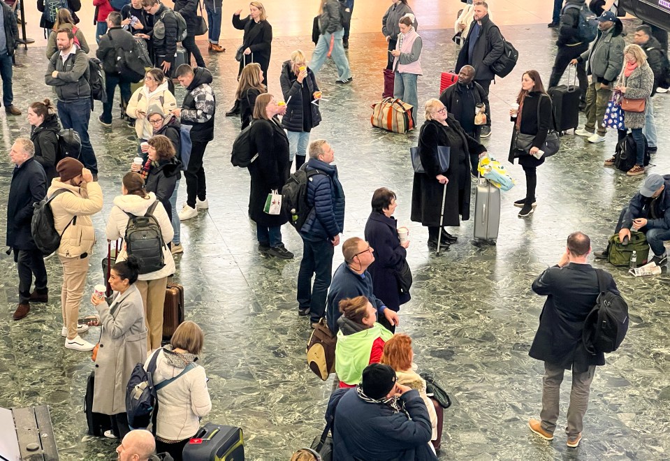 Passengers at London Euston station as nationwide fault causing rail travel disruption