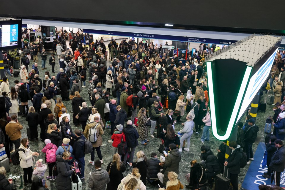 Passengers at London Euston station as storm Darragh causes travel disruption