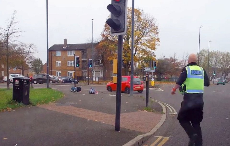 An officer who was in a patrol car behind Afzal is seen sprinting towards the man