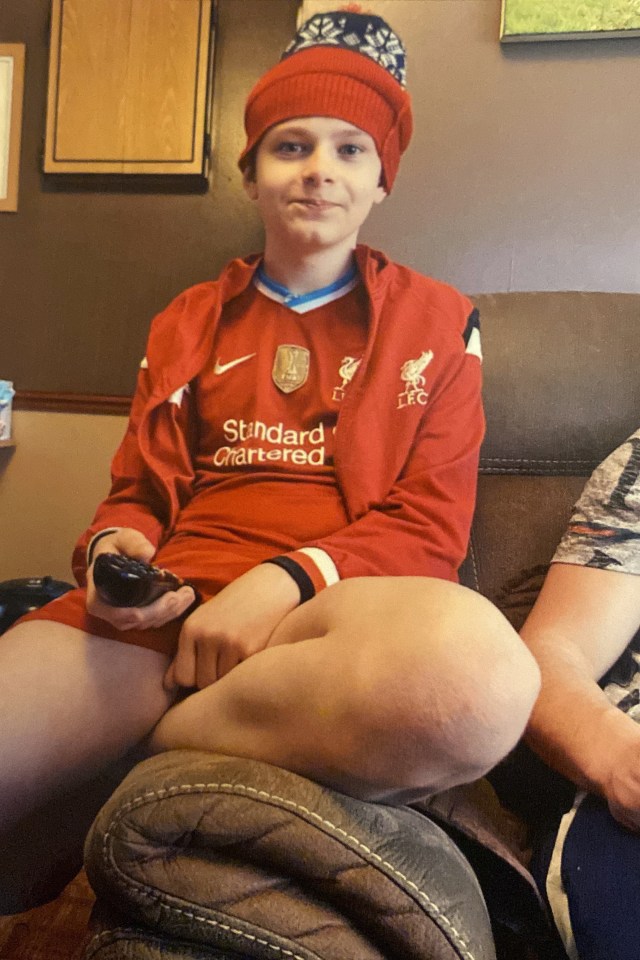 Photo of Mason Rist, 15, wearing a Liverpool football jersey.