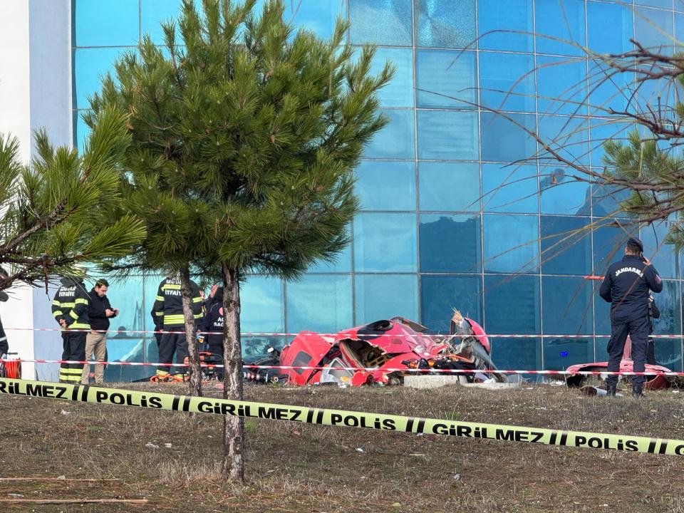 The plane wreckage on the ground by the hospital