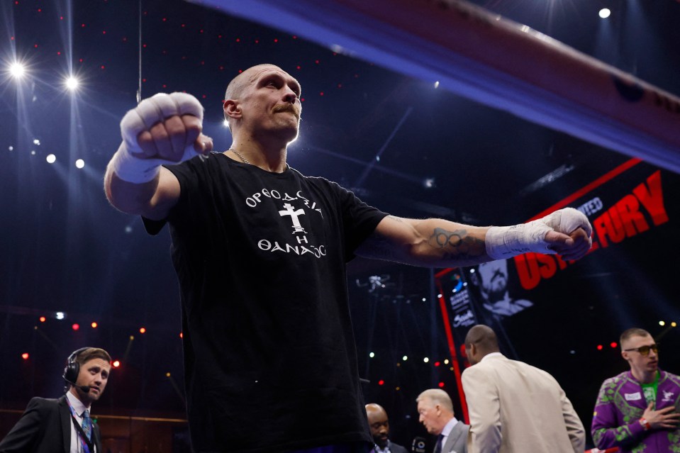 Oleksandr Usyk celebrates his heavyweight world title victory.