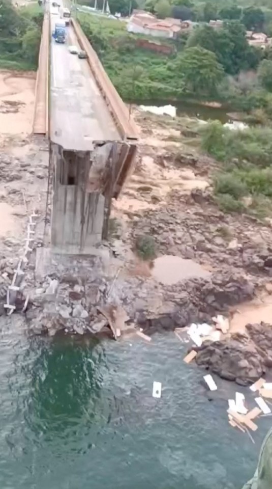 An aerial view shows a collapsed bridge between Aguiarnopolis and Estreito, in Brazil