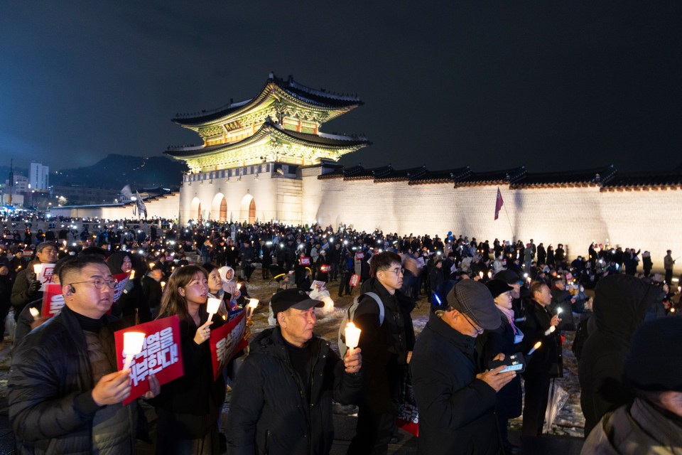 Nighttime protest in Seoul calling for the South Korean president's resignation.