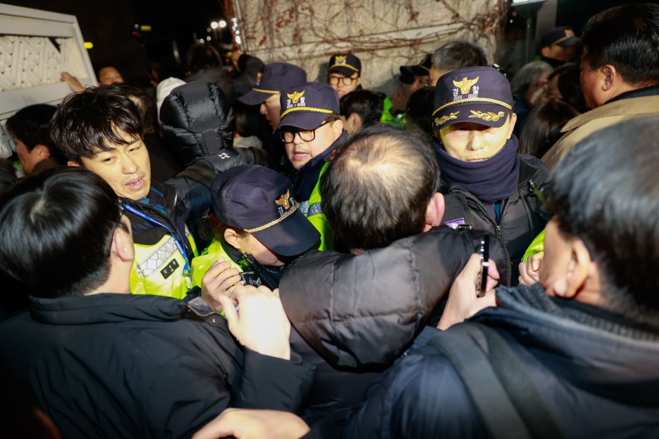 Protestors clash with police outside South Korea's National Assembly.