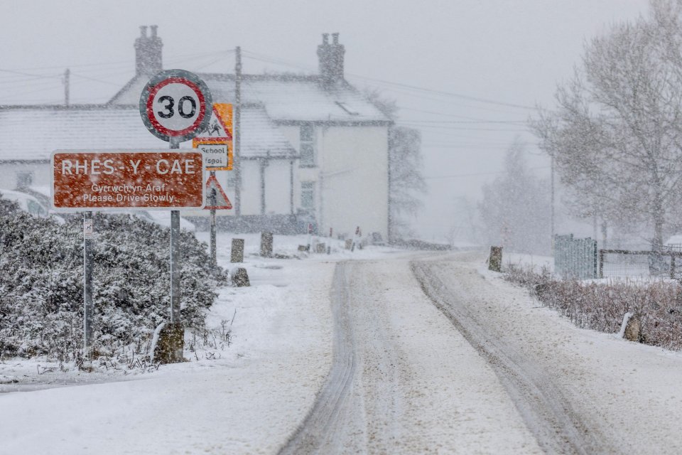 The village of Rhes-y-Cae during heavy snowfall in Flintshire