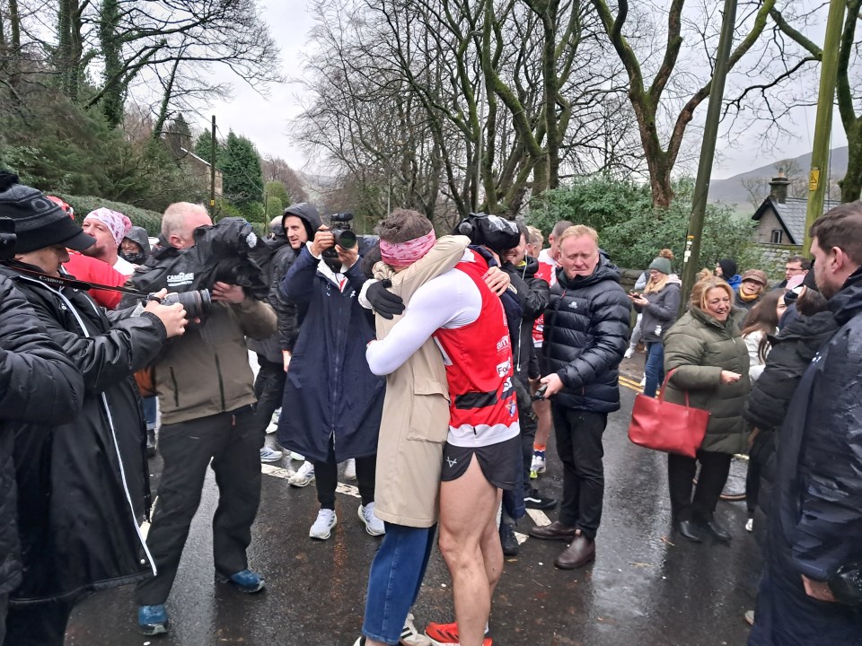 Sinfield was greeted with a huge hug from wife Jayne as he reached Saddleworth