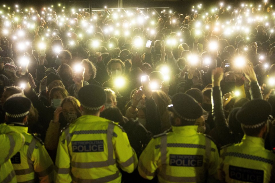 People turning on their phone torches in Clapham Common for a vigil for Miss Everard