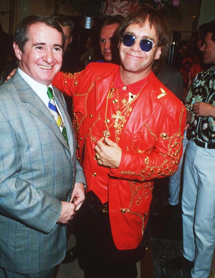 Sir Elton John pictured with manager John Reid