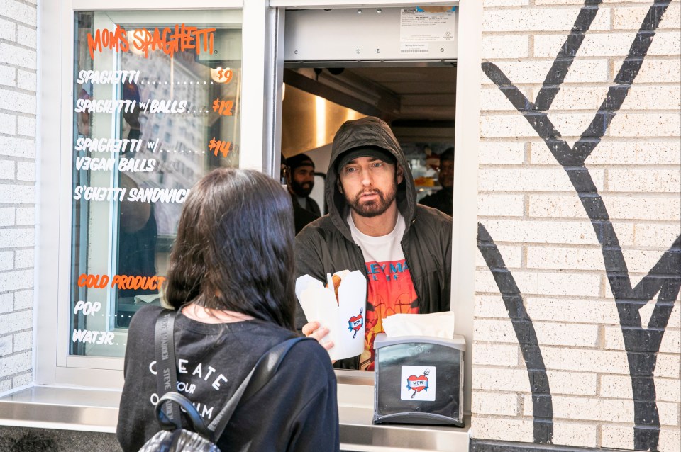 Eminem serves on the opening night of his restaurant Mom’s Spaghetti