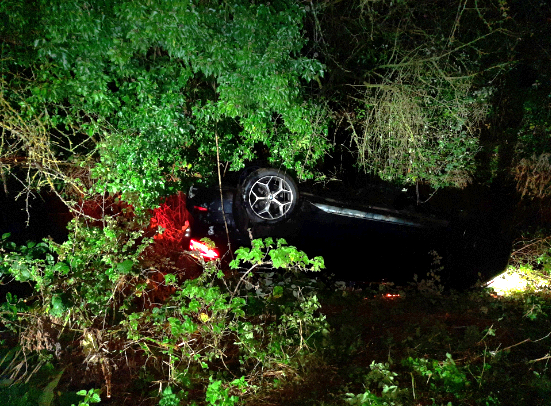 Car overturned in a ditch.