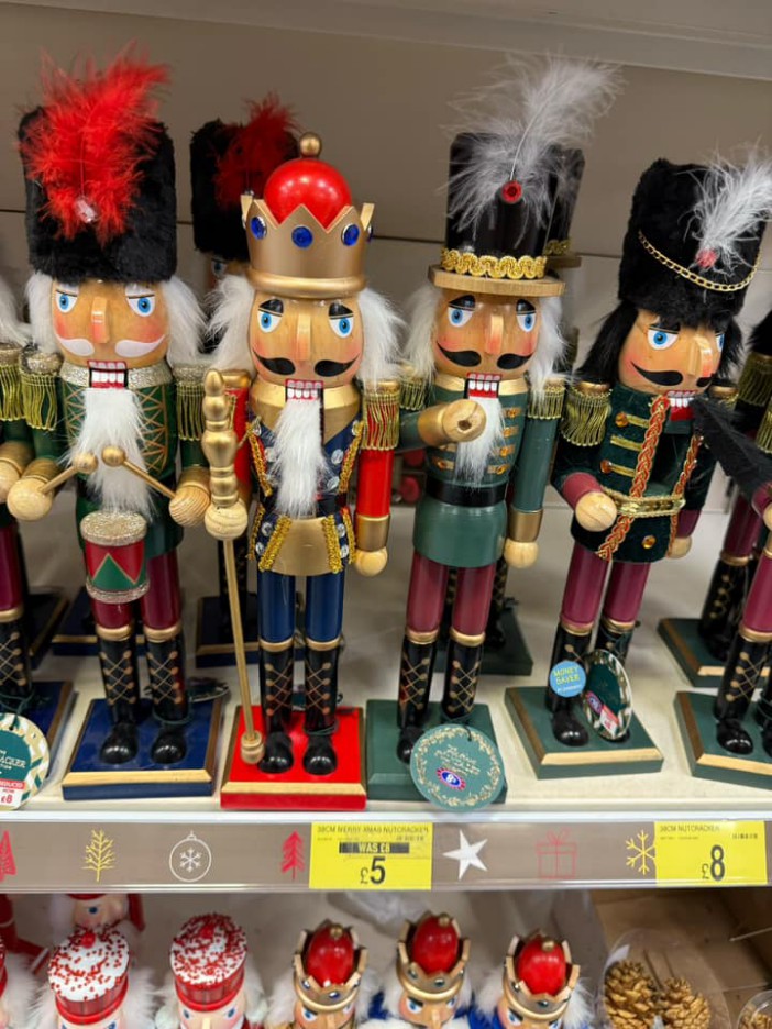 Four nutcrackers on a store shelf.