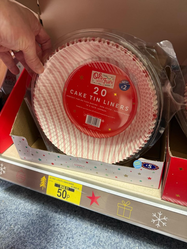 Twenty candy cane-striped cake tin liners, reduced to 50 pence.