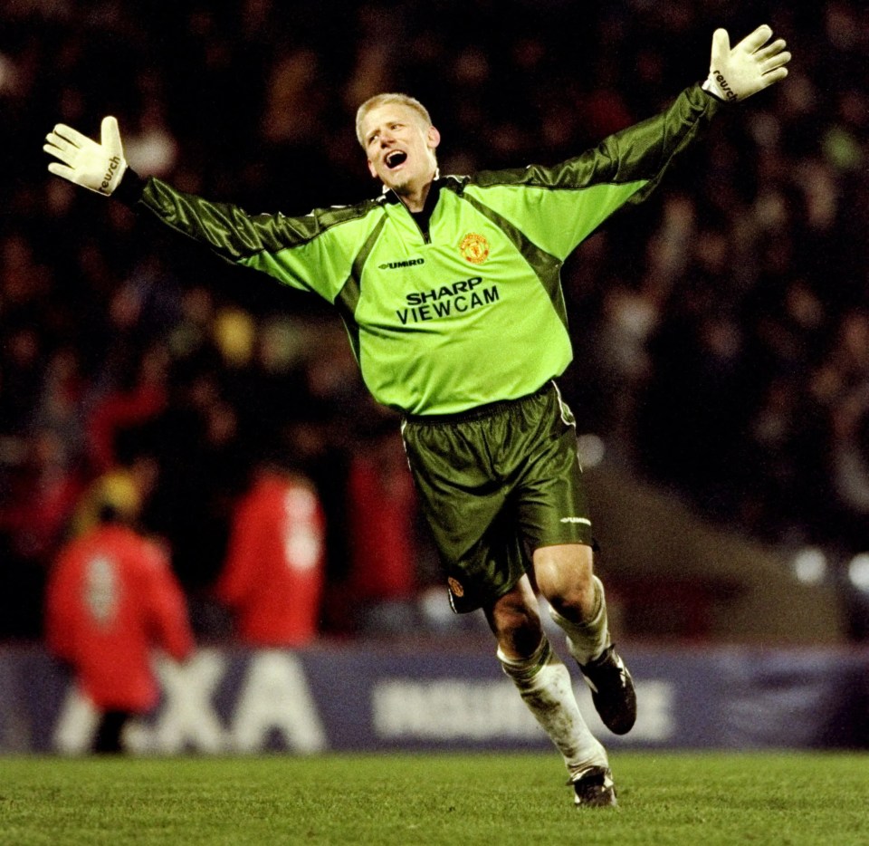 Peter Schmeichel of Manchester United celebrates after winning a soccer match.