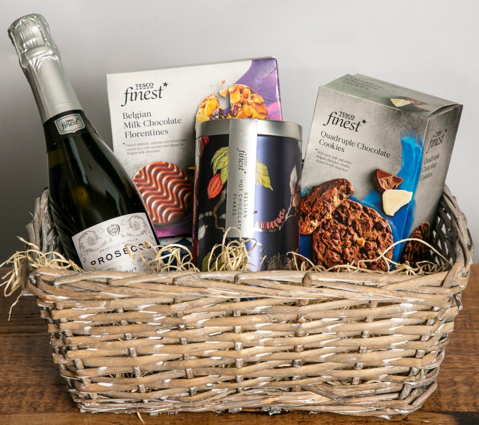 Tesco Finest Christmas hamper with prosecco, chocolates, and cookies.