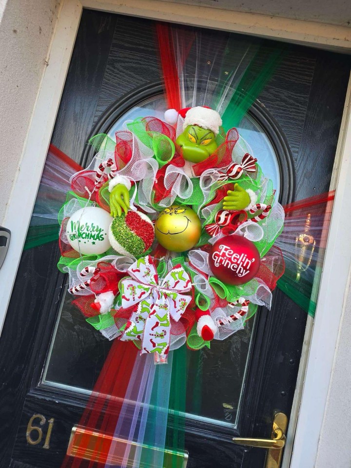 Her love of everything Grinch extends to the front door of her home in Manchester