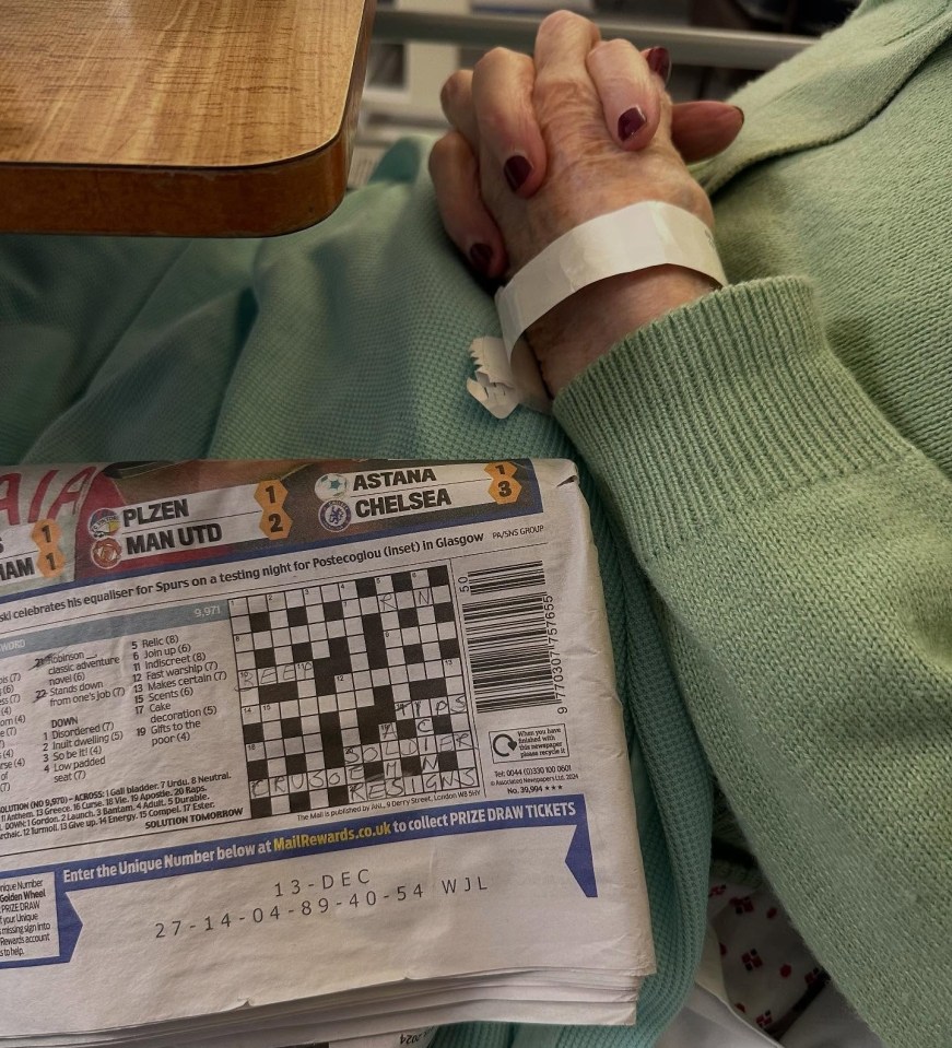 Joan was seen tackling a crossword in bed