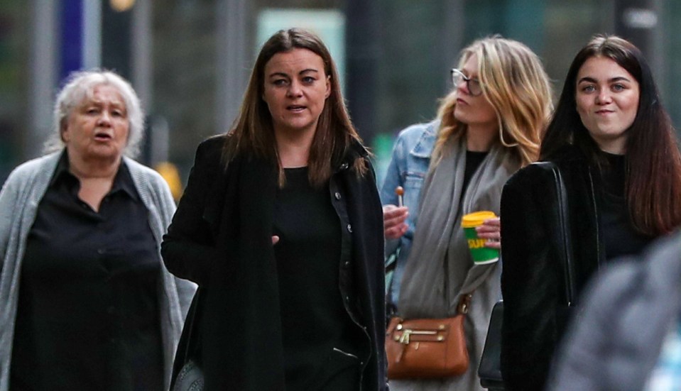 Pomfrey (left) walks to court with her daughter Aimee Brown (centre)