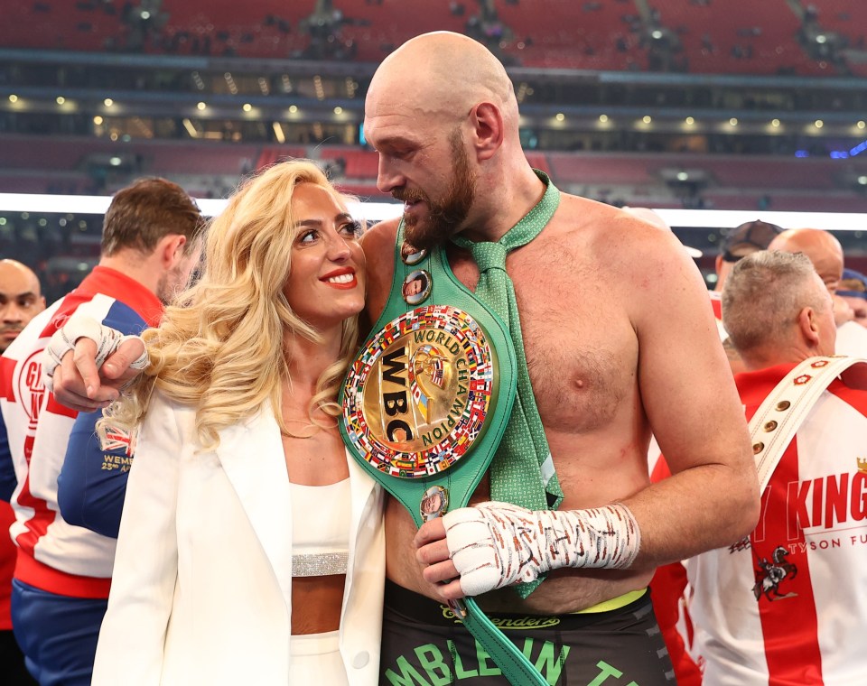 Tyson Fury and his wife Paris celebrate his WBC Heavyweight Championship win.