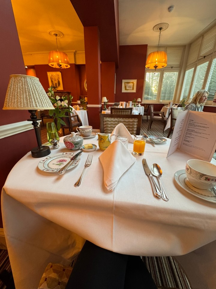 Breakfast table setting in a dining room.