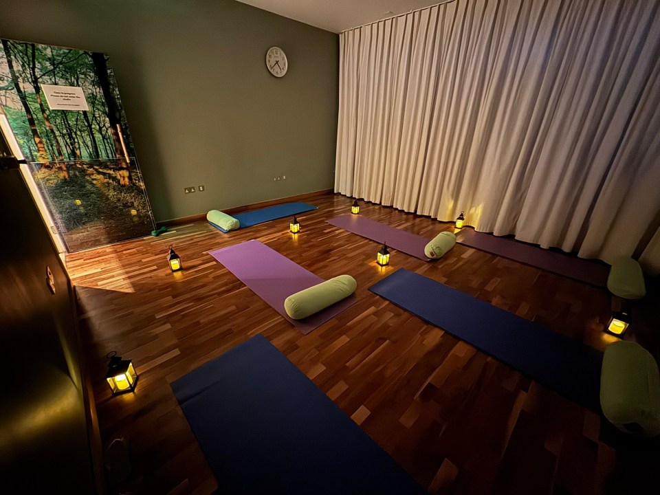 Yoga studio with mats and lanterns.