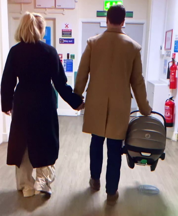 The happy family of three leave the hospital for the first time