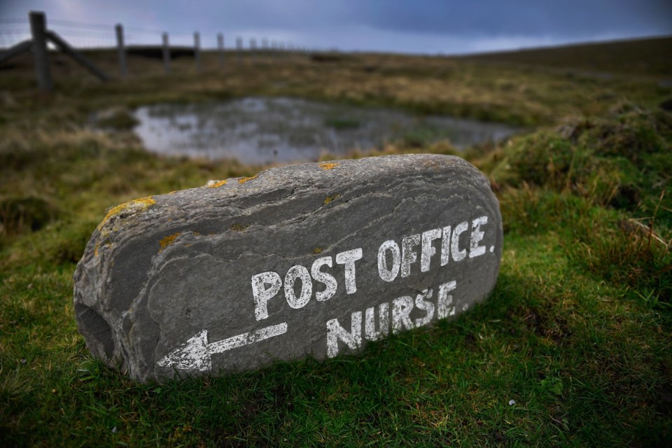 FOULA, SCOTLAND - SEPTEMBER 30:  Post mistress Sheila Gear, working in the Island of Foula Post Office on September 30, 2016 in Foula, Scotland. Foula is the remotest inhabited island in Great Britain with a current population of thirty people and has been owned since the turn of the 20th century by the Holbourn family.  (Photo by Jeff J Mitchell/Getty Images)