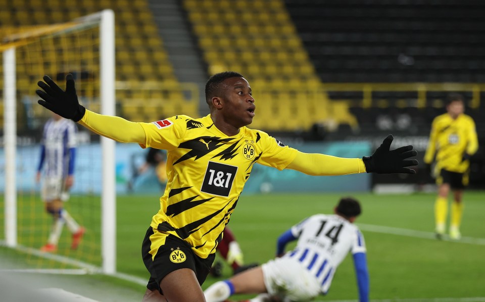 Youssoufa Moukoko of Borussia Dortmund celebrates scoring a goal.