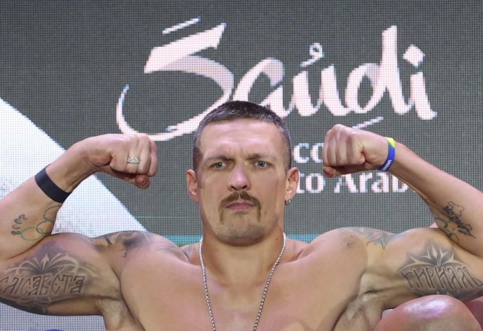 Usyk's children's names appear on his biceps in Ukrainian script