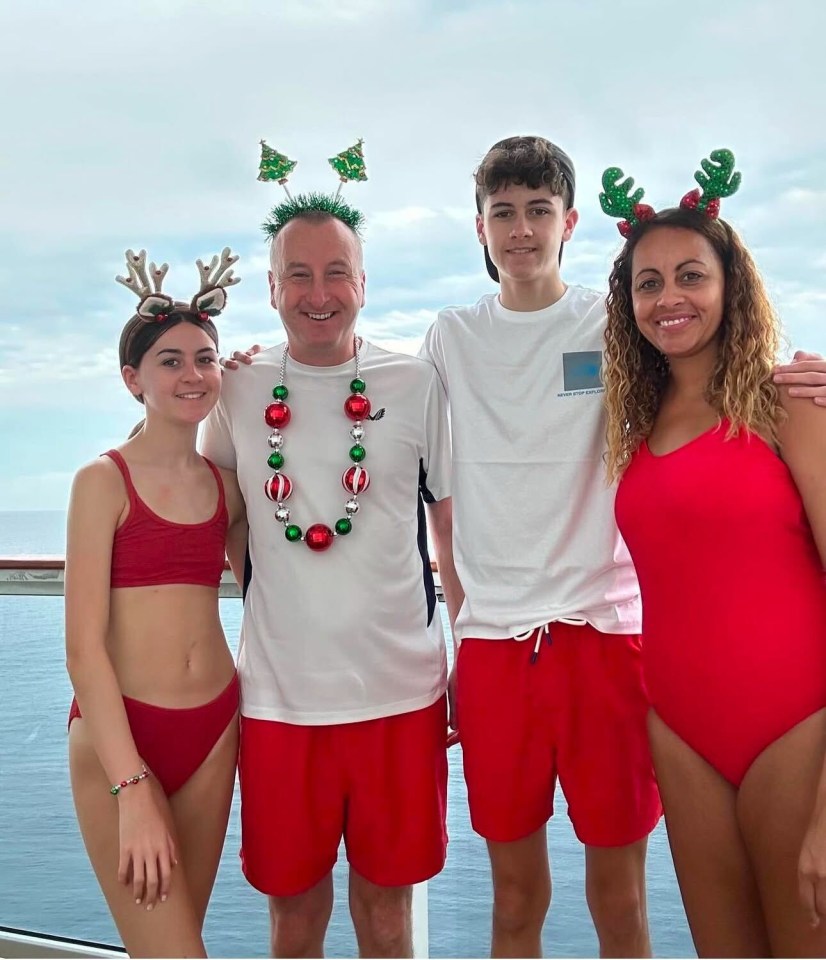 Family in Christmas attire on a cruise ship.