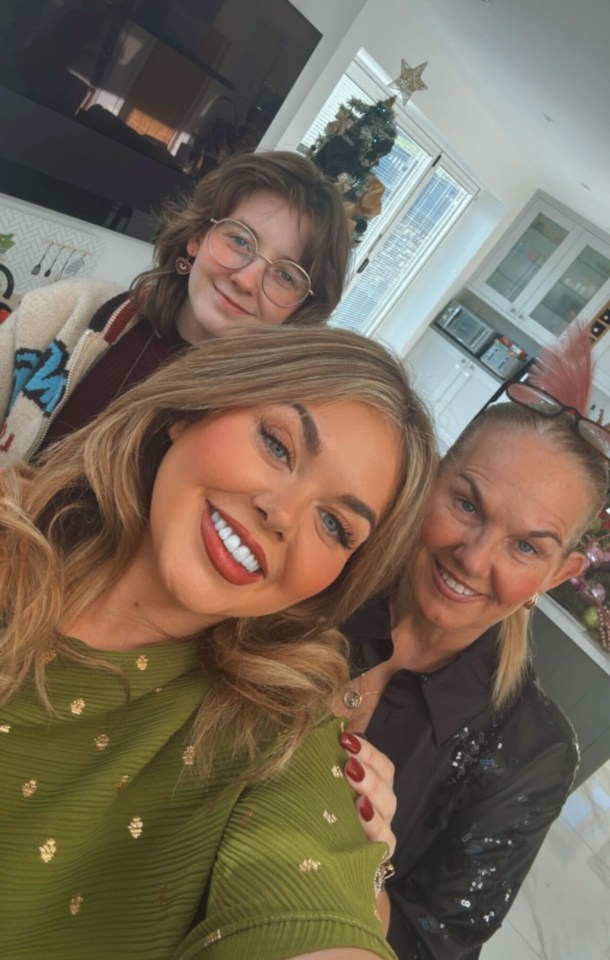 Three women posing for a selfie.