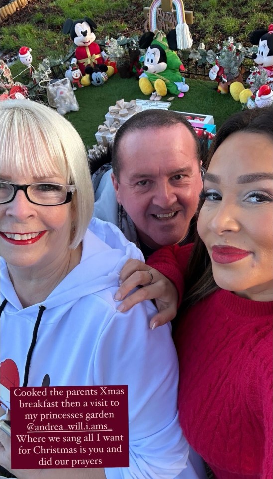 Family Christmas selfie at a princess-themed garden.