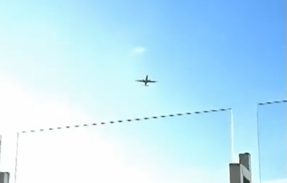 Grainy footage captures the plane flying near the airport