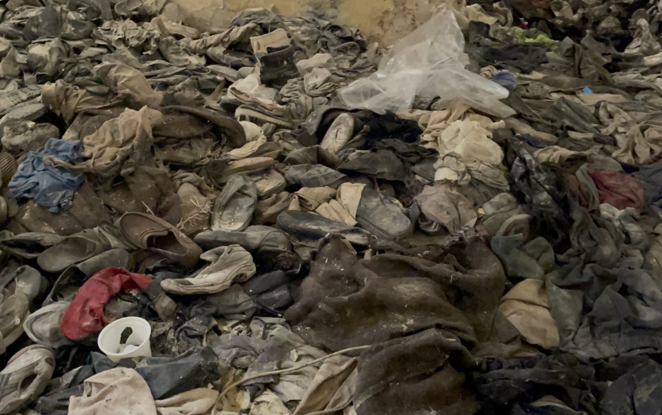 Dozens of shoes found in a secret compartment at Sednaya Prison after the fall of the Assad regime in Damascus, Syria