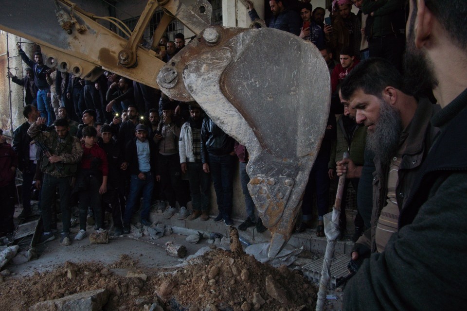 Syrian Civil Defense teams carry out investigations in secret compartments of the hellhole prison