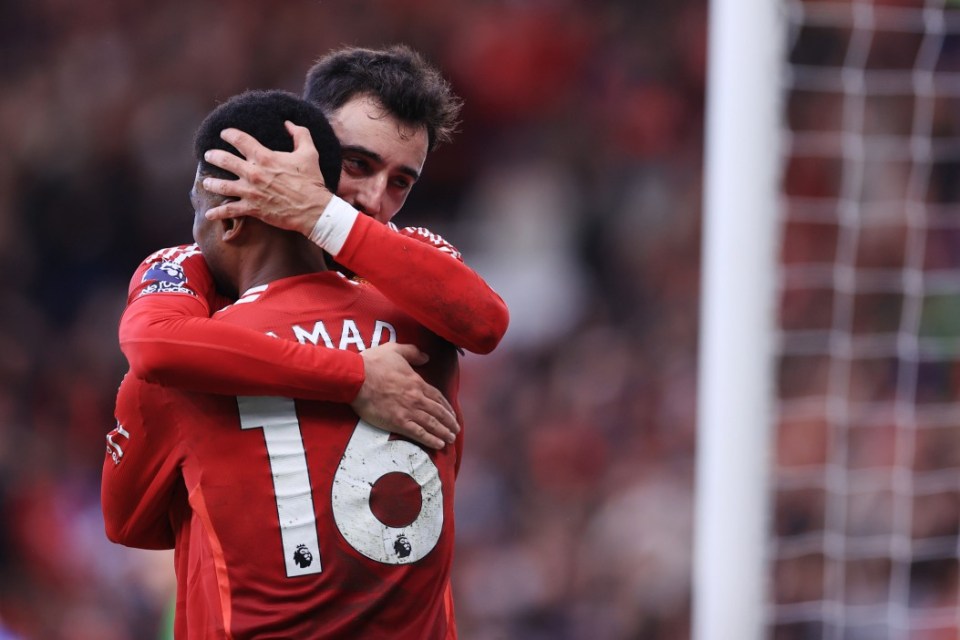 MANCHESTER, ENGLAND - DECEMBER 1: Bruno Fernandes of Manchester United hugs Amad Diallo of Manchester United during the Premier League match between Manchester United FC and Everton FC at Old Trafford on December 1, 2024 in Manchester, England. (Photo by Simon Stacpoole/Offside/Offside via Getty Images)