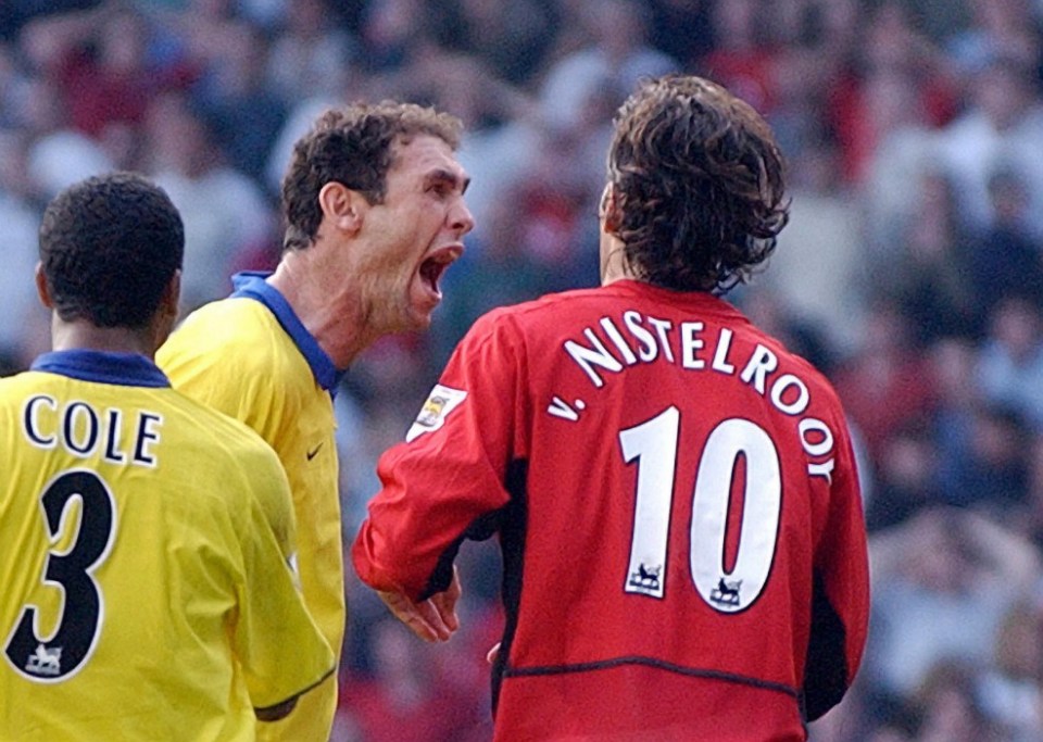 Arsenal's Martin Keown taunts Manchester United's Ruud Van Nistelrooy after he missed a penalty given away by Keown in the final minutes of todays Premiership clash at Old Trafford, Manchester 21 September 2003. AFP Photo by Paul Barker (Photo credit should read PAUL BARKER/AFP/Getty Images)