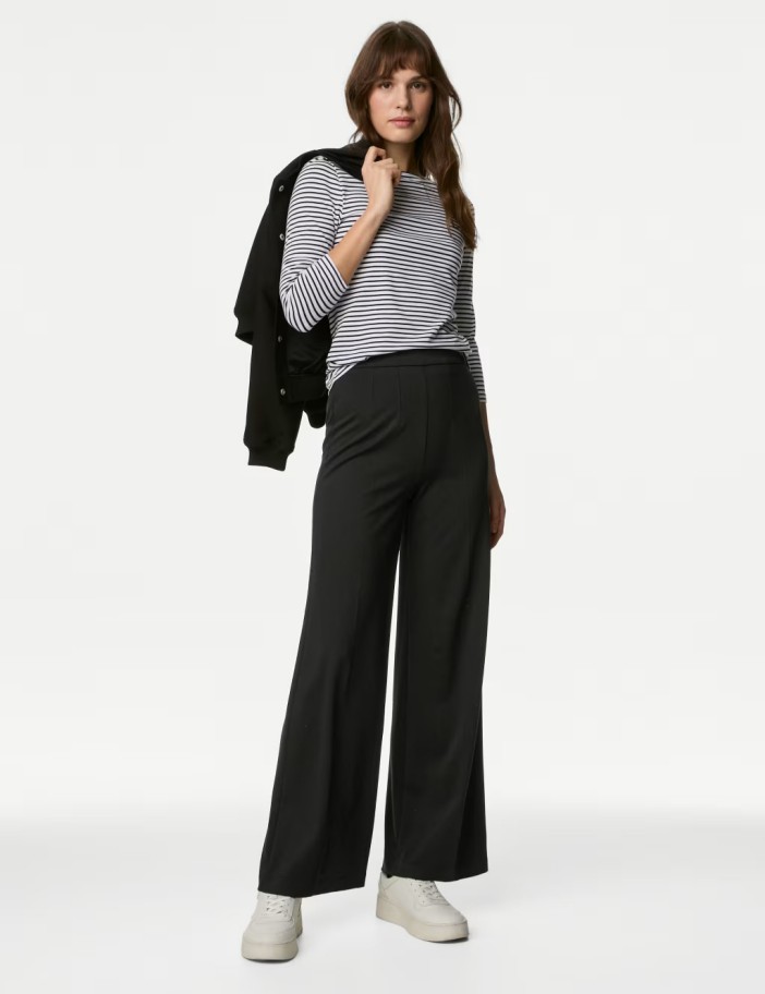 The trousers have a wide-leg and stretch material for ultimate comfort.