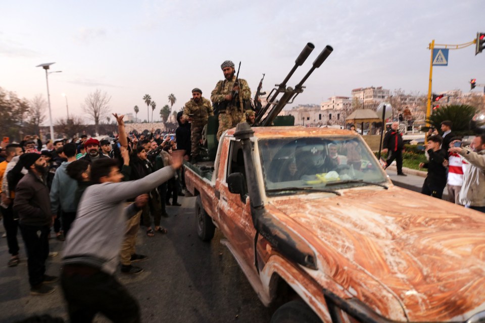 Residents take to the streets of Hama welcoming rebel fighters after they captured the city