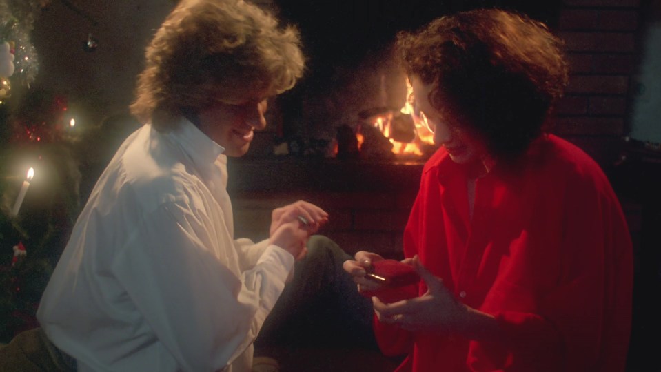 George woos Kathy in the fireside scene