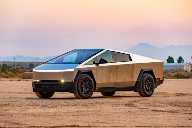 Tesla Cybertruck in desert setting.