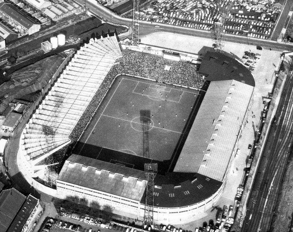 Aerial view of Old Trafford stadium during a soccer match.