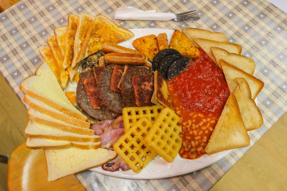 The Hungry Hossee breakfast features mountains of bread, bacon, hash browns, beans and tomatoes