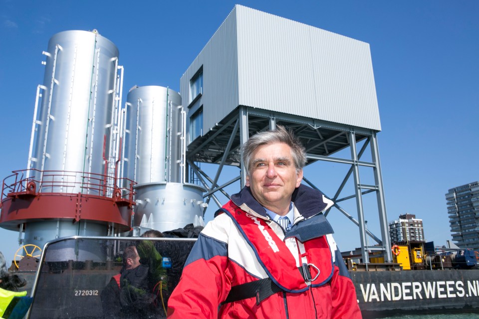 Architect David Marks with the the first of the 17 cans which form the tower