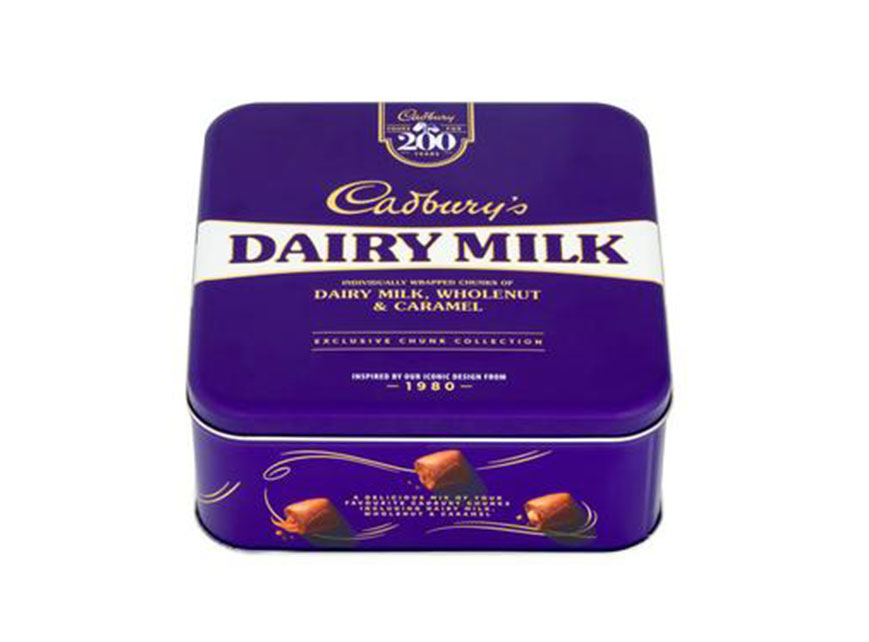 Cadbury Dairy Milk tin of individually wrapped chunks of Dairy Milk, whole nut & caramel.