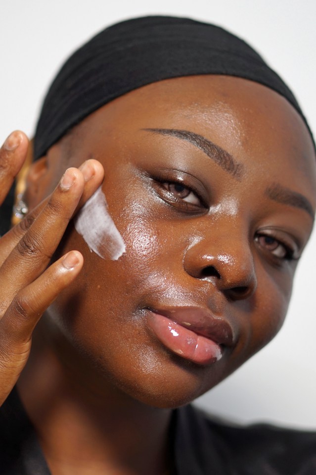 Person applying face cream.